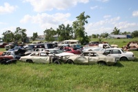 Another lot of destroyed vehicles and one was moved in as we passed by