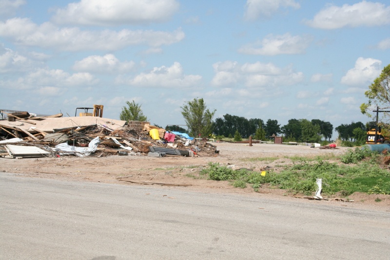 Lot after lot is clean with debris still to be removed pushed to the front