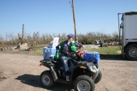 Relief worker brings water