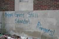 Wonder if kids wrote it or teachers.  Acceptable Grafitti on the school