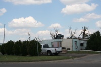 Car in roof of building - The odd is the ordinary