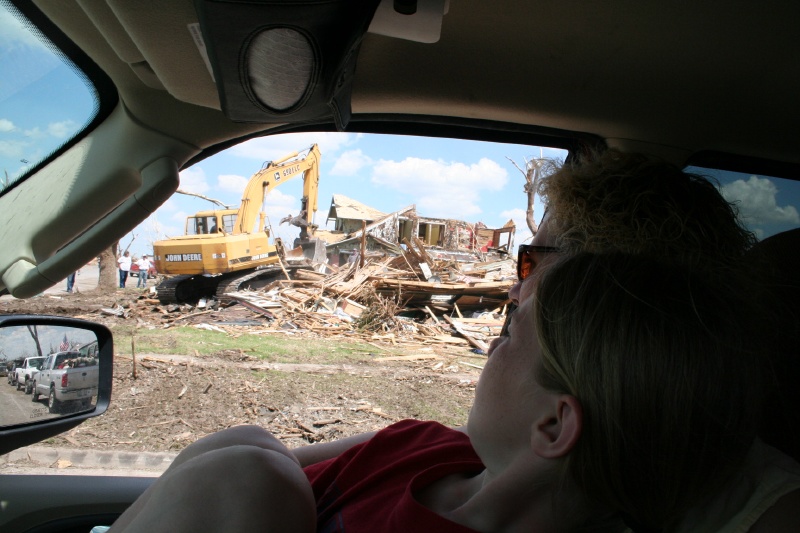 Kim and Katelynn watch a friend's house come down