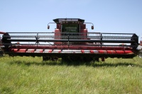 The plugged up combine under repair