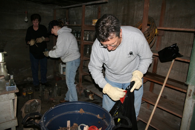 Friends clean the storm shelter