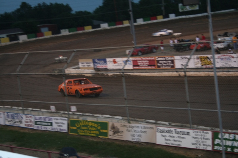 He takes the checkered in the feature!