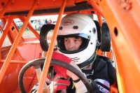 The harness clips to the helmet.