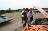 Fellow racers inspect the crash