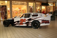 The boys choose where she is placed in the mall.