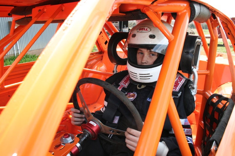 He also wears a firesuit, and a head and neck restraint